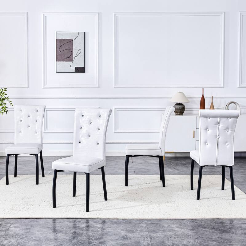 A set of 4 white and black vintage crocodile leather cushioned dining chairs, featuring crystal clasp design and leather