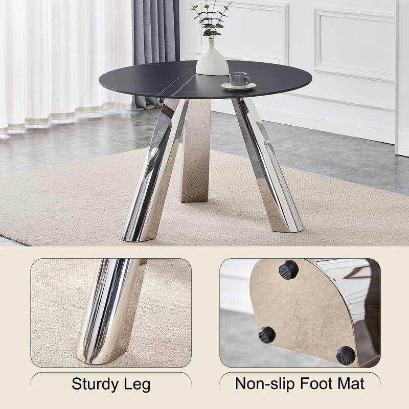 A 42-Inch Round Table with Stainless Steel Legs and a Marble Top, Perfect for 4 to 6 People.