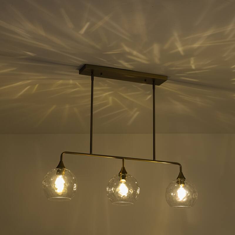 3-Light Modern Black/Brushed Gold Linear Chandelier for Kitchen Island with Clear Textured Glass Globe Shades