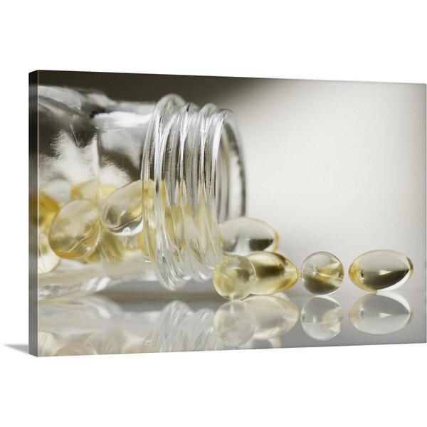"Gelcaps spilling out of glass bottle" Canvas Wall Art