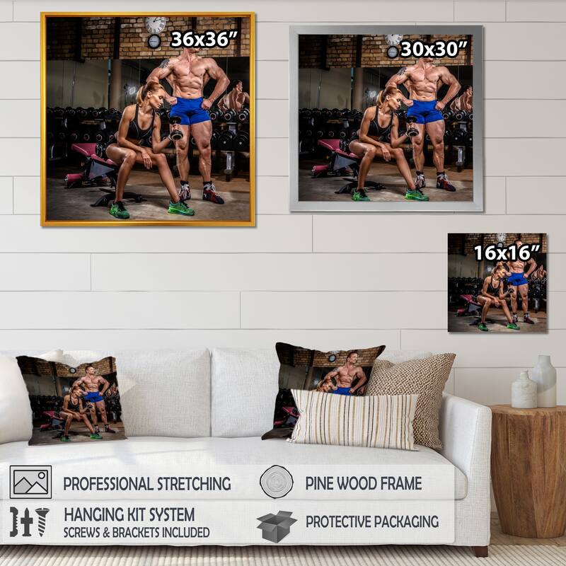 Designart "Sports Couple Is Working Out Gym" Aerobic & Bodybuilding Framed Canvas Prints