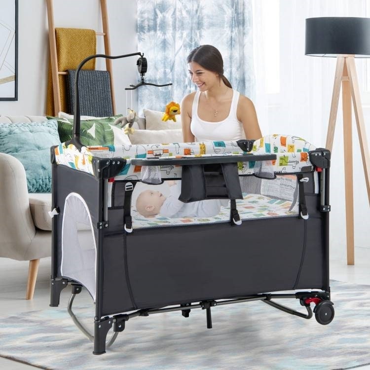 5-in-1 Infant Bed Cradle Changing Table with Side Storage and Music Rack Safety Strap - 43" x 29.5" x 32.5" (L x W x H)