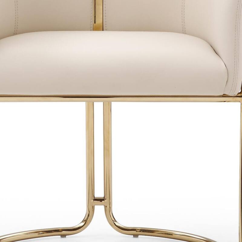 HomeRoots Beige and Gold Faux Leather and Metal Partially Open Back Dining Arm Chair - 25.00 in. x 31.00 in. x 23.00 in.