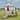 Backyard Discovery Sweetwater Heights White Wooden Playhouse w/ Slide - 6'3" x 10'0"