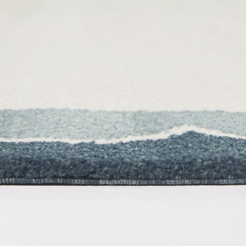 Caldeira Scalloped Border Area Rug