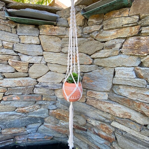 41" H hanging macrame planter hanger. Opens flyout.
