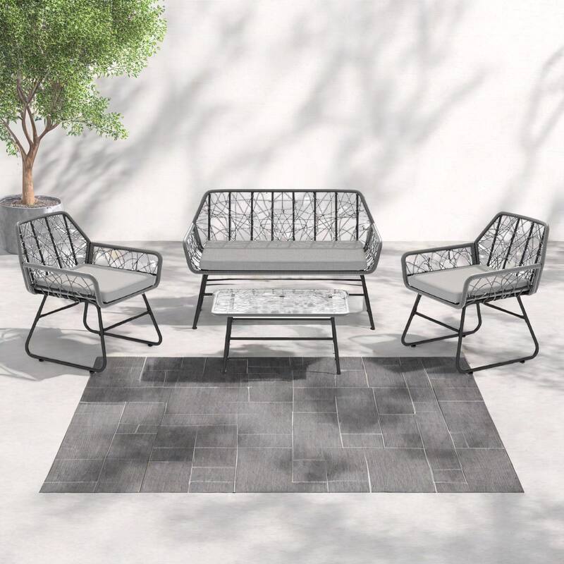 4-Piece Outdoor Woven Rattan Cnversation Sofa Set with Tempered Glass Coffee Table and Waterproof Cushions