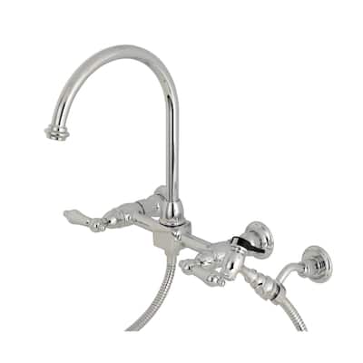 Kingston Brass Restoration Wall Mount Bridge Kitchen Faucet with Brass Sprayer