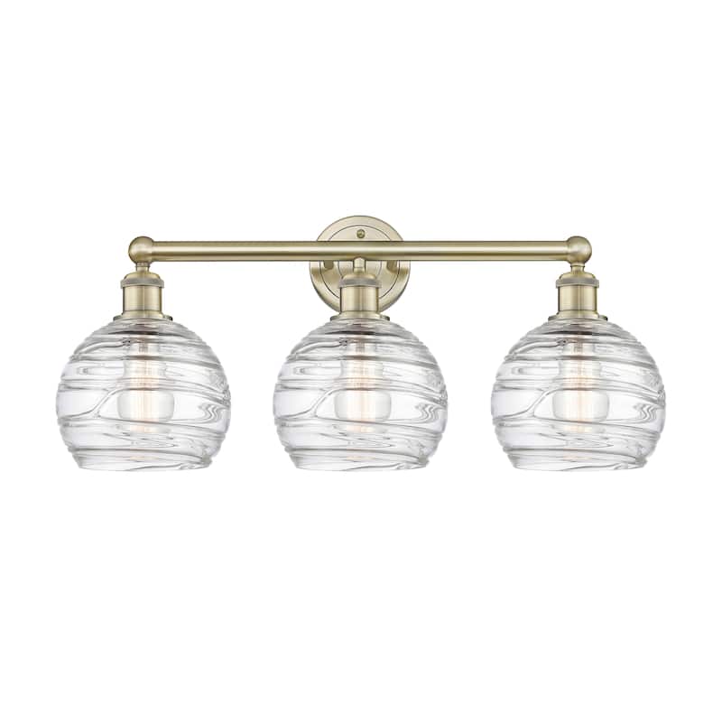 Innovations Lighting Athens Deco Swirl - 3 Light 26" Bath Vanity Light. - Antique Brass/Clear Deco Swirl