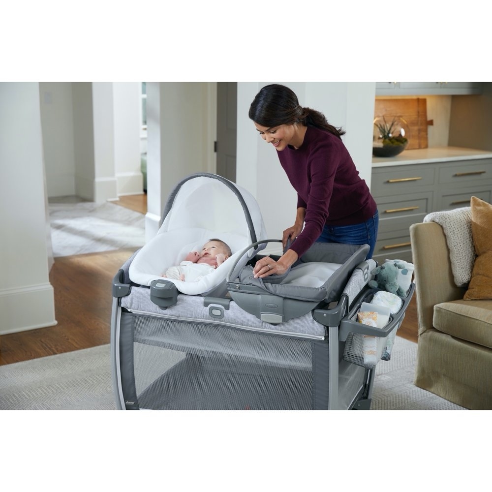 Pack `n Play Quick Connect Portable Seat DLX Playard featuring