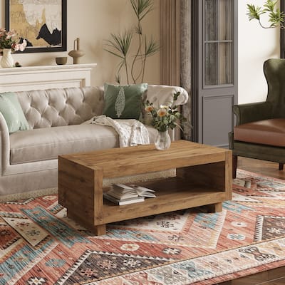 A modern minimalist wood-colored rectangular coffee table embodies the simple charm of mid-century aesthetics