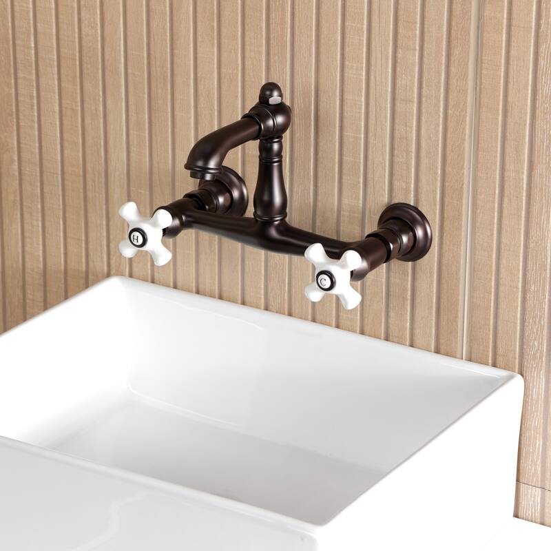 Kingston Brass English Country Two-Handle 2-Hole Wall Mount Bathroom Faucet