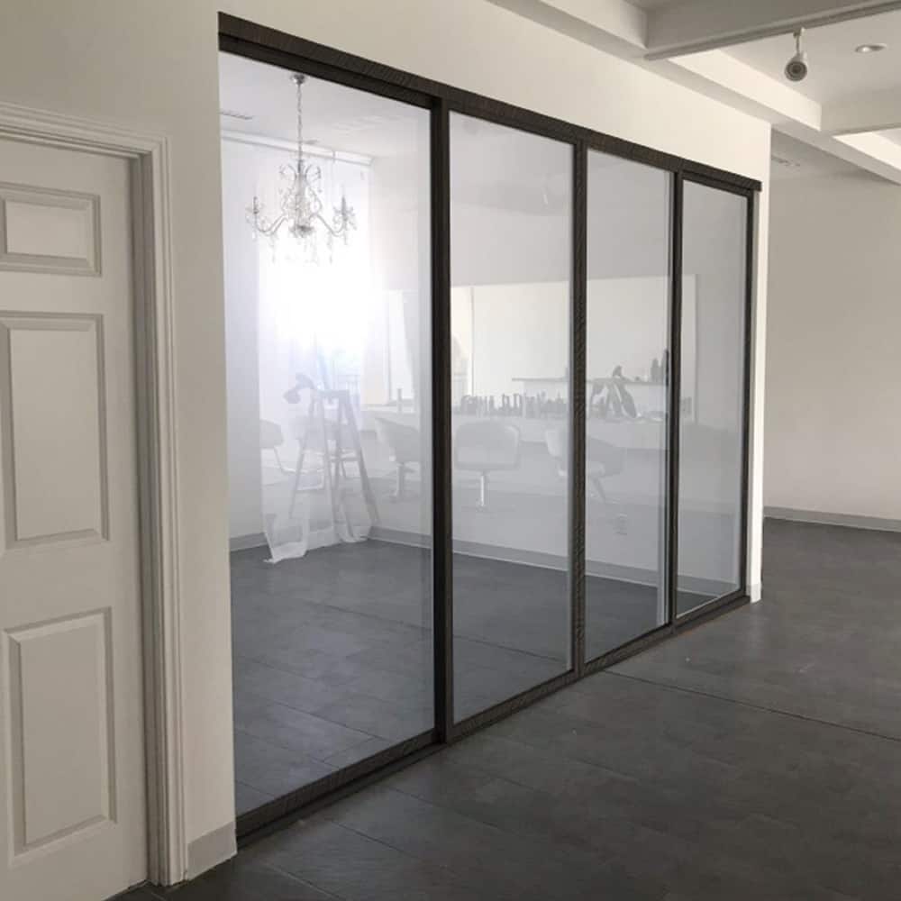 THE SLIDING DOOR COMPANY 4 Panel, sliding room divider, Clear Glass and Aluminum Frame on double track.