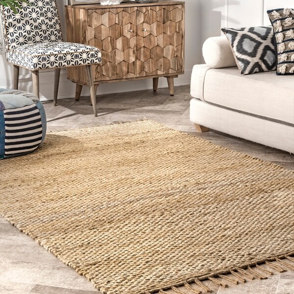 The Curated Nomad Nevada Natural Jute Handmade Tassel Area Rug. Opens flyout.