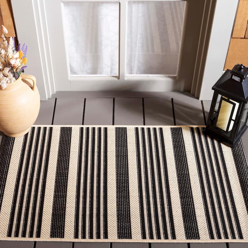 SAFAVIEH Courtyard Orsi Indoor/ Outdoor Waterproof Area Rug - 2'3" x 5' - Black/Bone
