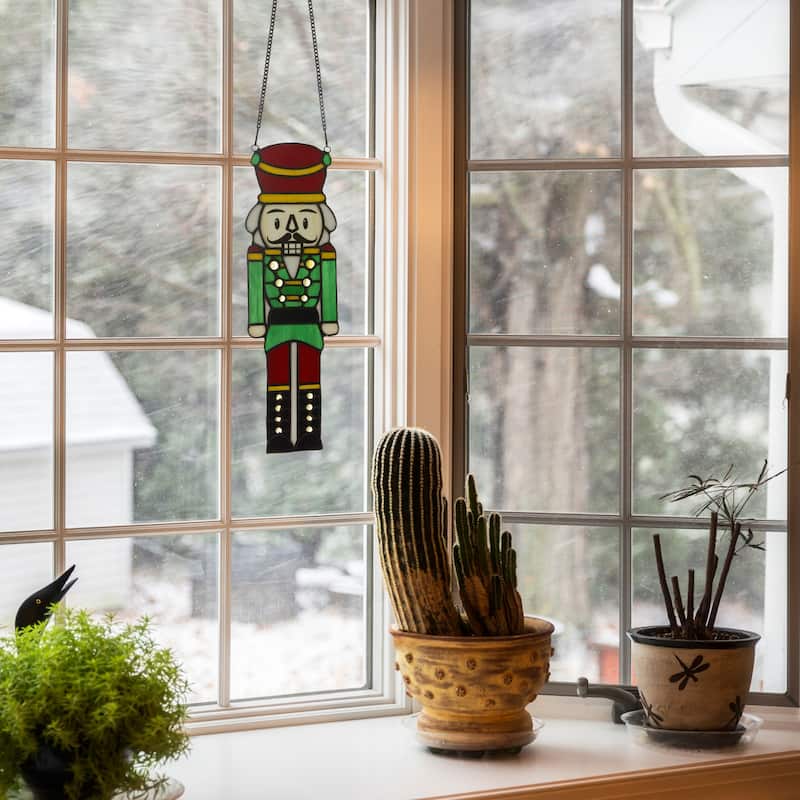 Cornelius River of Goods 14-Inch Red and Green Holiday Nutcracker Stained Glass Window Panel - 4.25" x 0.25" x 14"