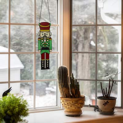 Cornelius River of Goods 14-Inch Red and Green Holiday Nutcracker Stained Glass Window Panel - 4.25" x 0.25" x 14"