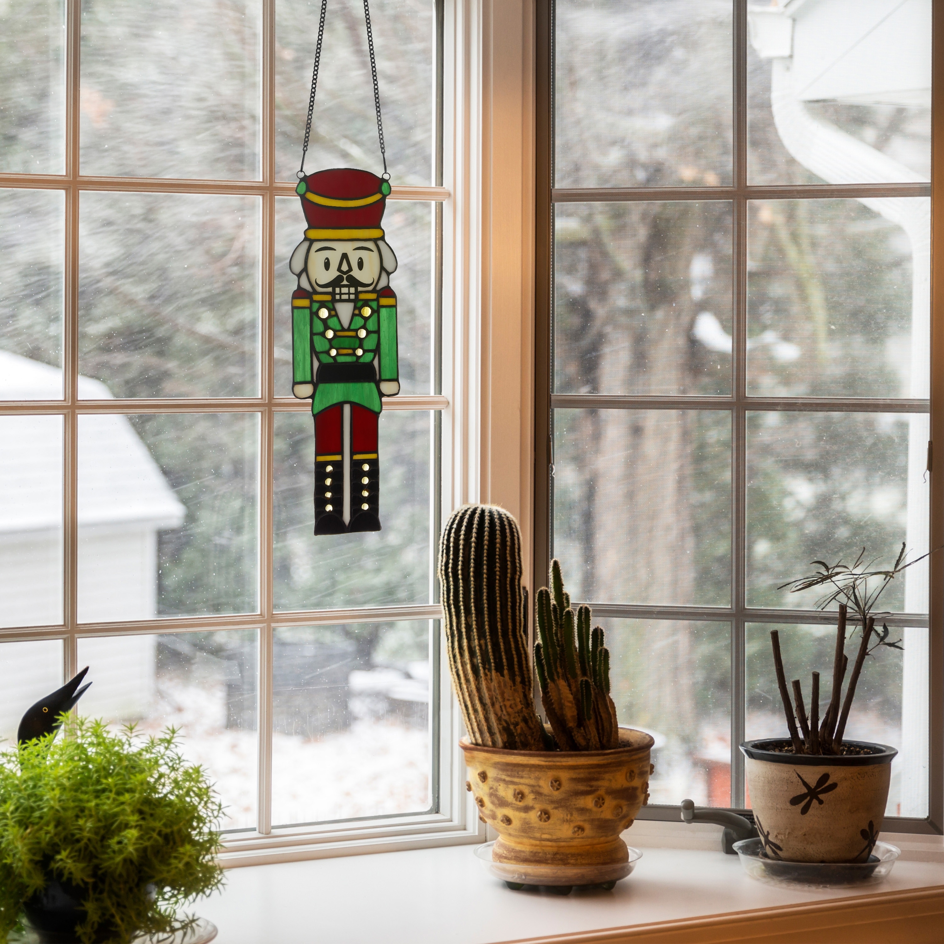 River of Goods Cornelius 14-Inch Red and Green Holiday Nutcracker Tiffany-Style Stained Glass Window Panel - 4.25" x 0.25" x 14"
