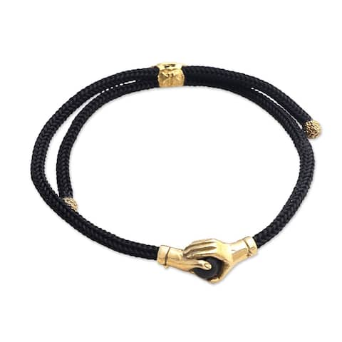 NOVICA Golden Handshake, Brass and obsidian unity bracelet