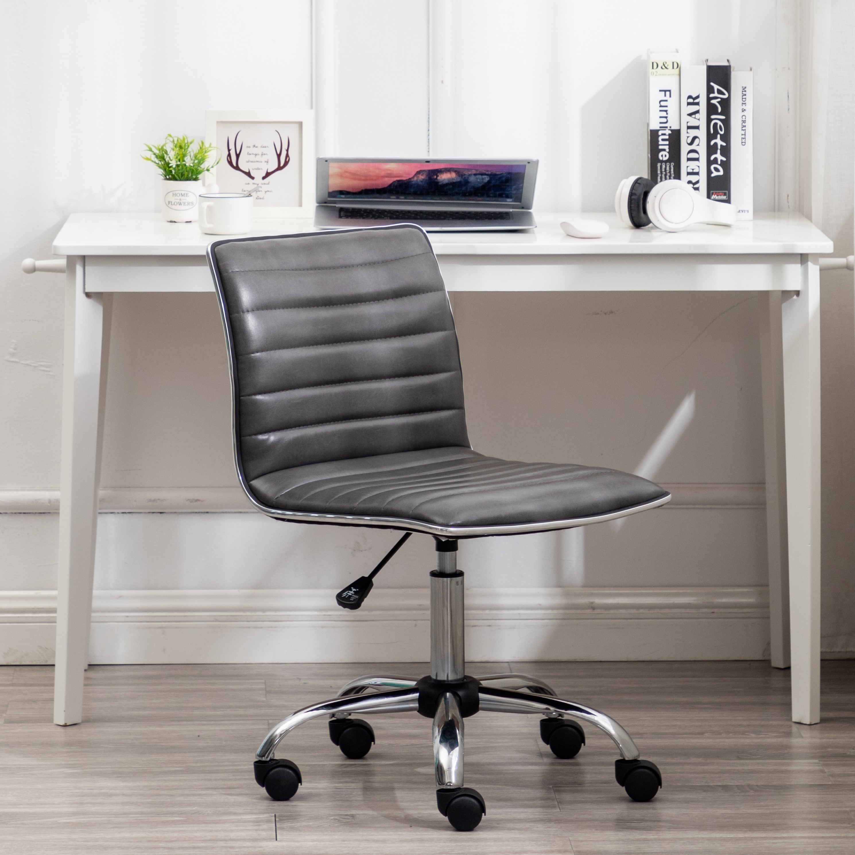 https://ak1.ostkcdn.com/images/products/is/images/direct/cf0af5ff25d31155cd8a19f7f541cfc0f0ddee42/Swivel-Mid-Back-Armless-Ribbed-Designer-Task-Chair-Faux-Leather-Soft-Upholstery-Office-Chair-Gray.jpg
