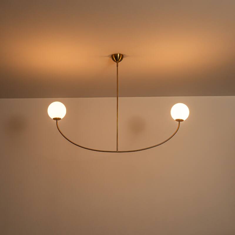 55" Modern Linear 2-Light Brass Finish Island Pendant with Milk White Glass Globe Shades for use in Dining Room