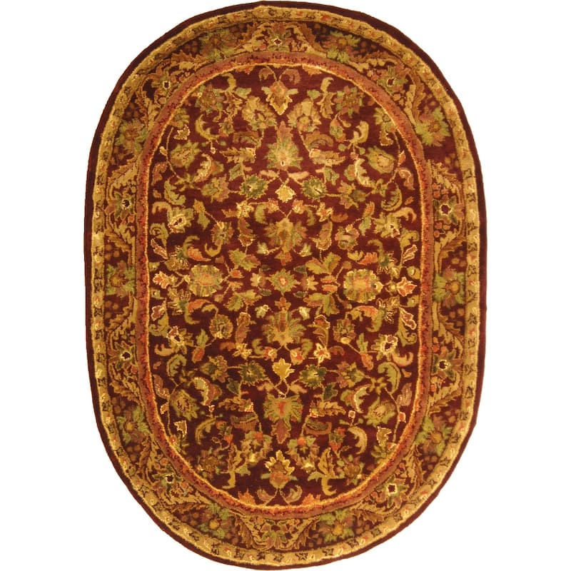 SAFAVIEH Handmade Antiquity Manerva Traditional Oriental Wool Rug - 7'6" x 9'6" Oval - Wine/Gold
