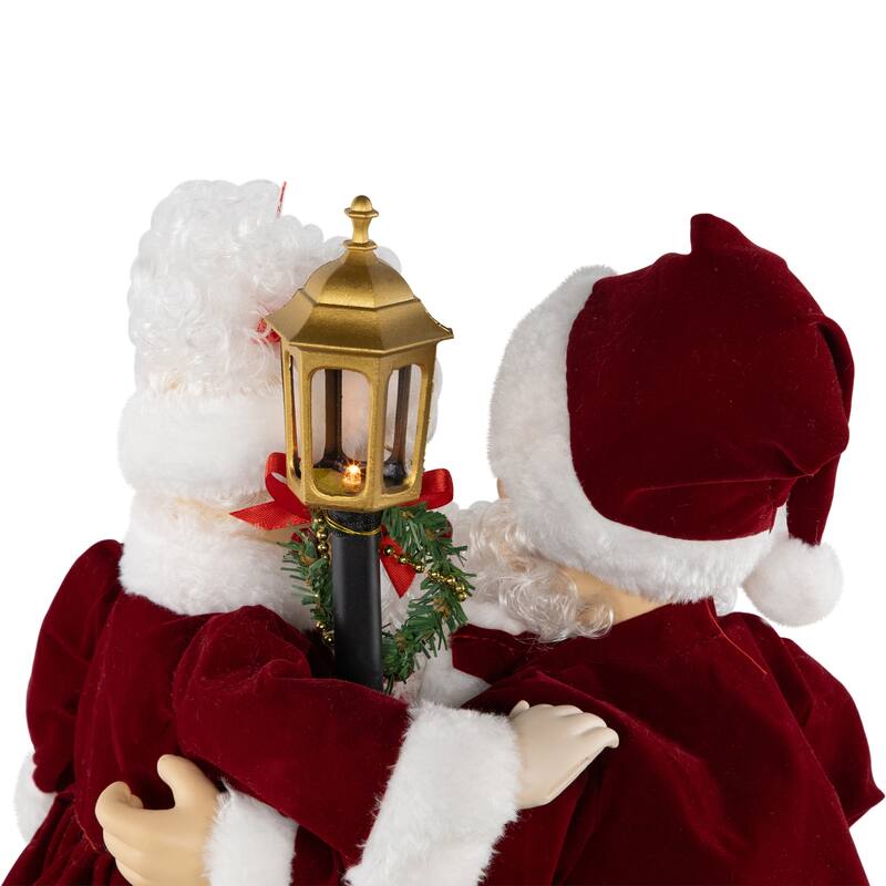 Animated and Musical Mr. and Mrs. Claus Figures with Lighted Lamppost and "Merry Christmas" Sign - 18"