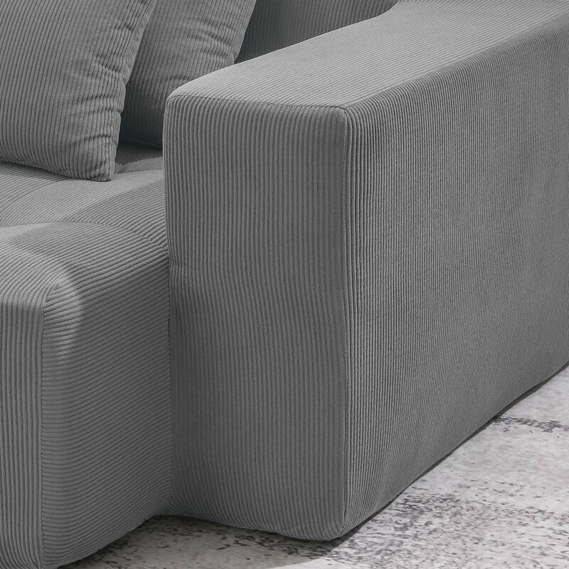 L-shaped corduroy upholstered sectional sofa with ottoman