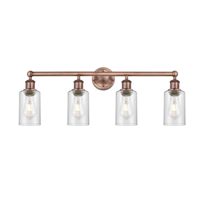 Innovations Lighting Clymer - 4 Light 31" Bath Vanity Light - Antique Copper/Seedy