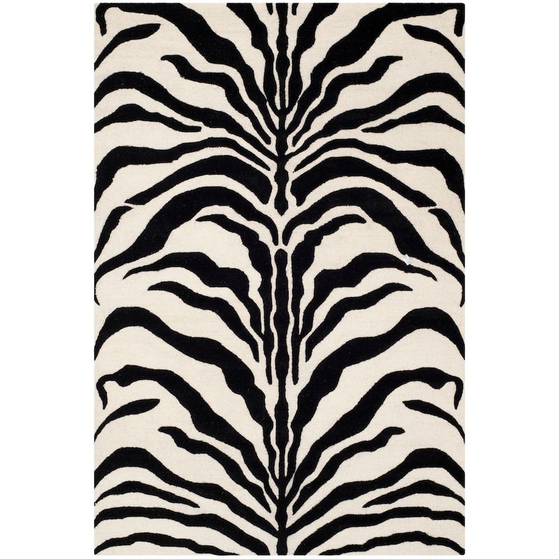 SAFAVIEH Handmade Cambridge Rikey Animal Print Wool Rug - 6' x 9' - Ivory/Black