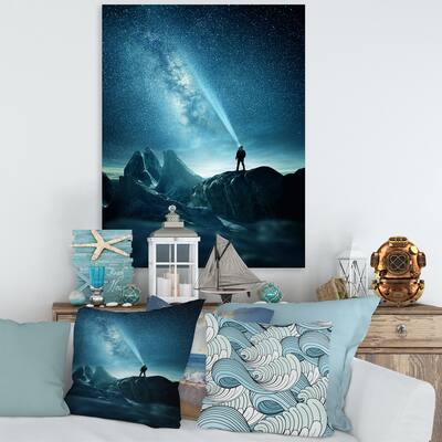 Designart "A Man Shining A Light Into The Night Sky" Modern Canvas Wall Art Print