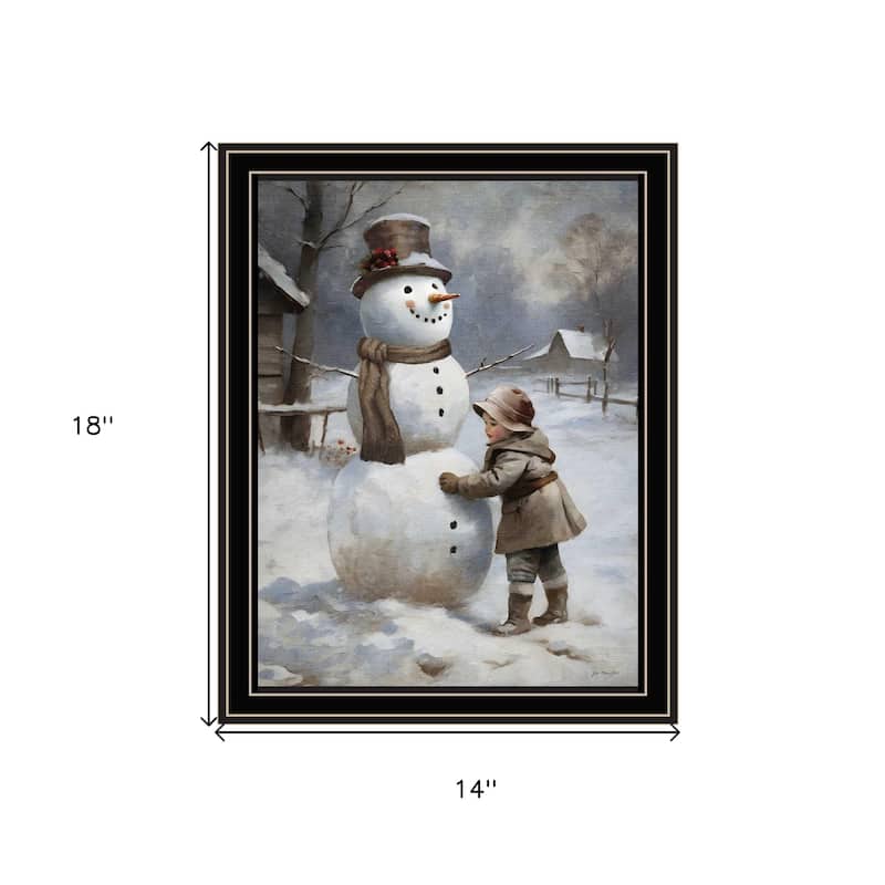 HomeRoots Boy Building A Snowman Black Framed Wall Art
