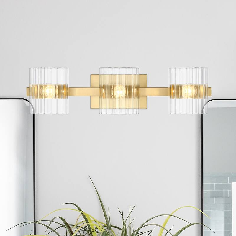 Aries 24.25 in. 3-Light Brushed Gold Transitional Vanity Light with Ribbed Glass Shades