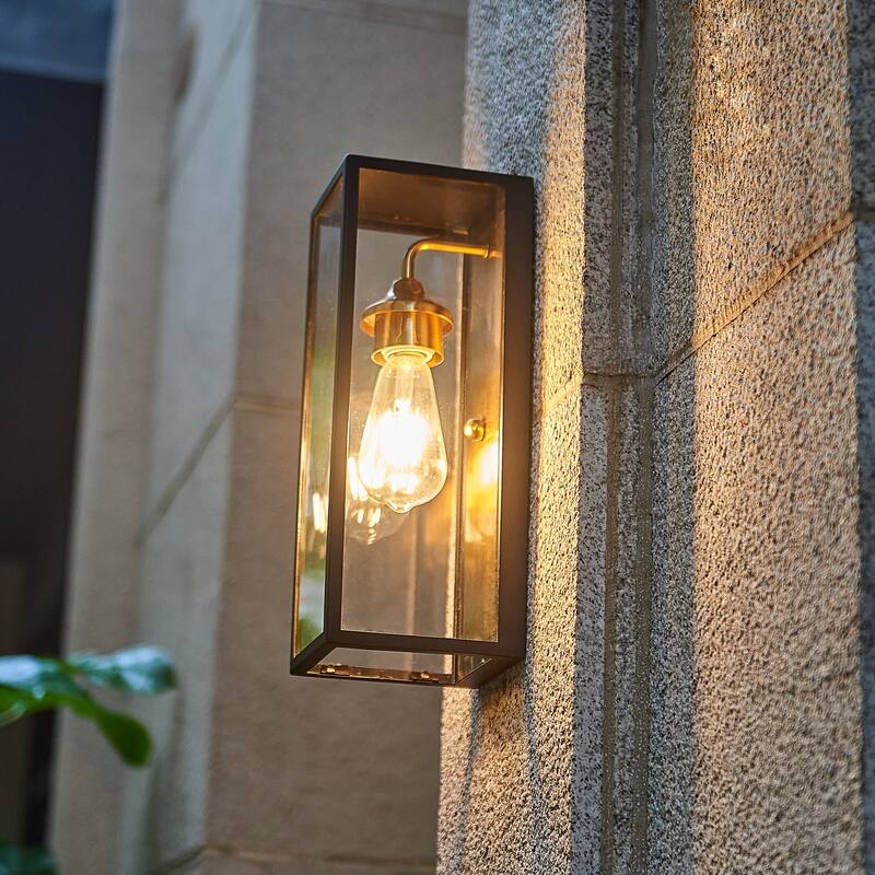 1 Light outdoor wall sconce with clear glass, Black exterior , gold interior Finish - 14"H x 4.75"W x 5.5"D