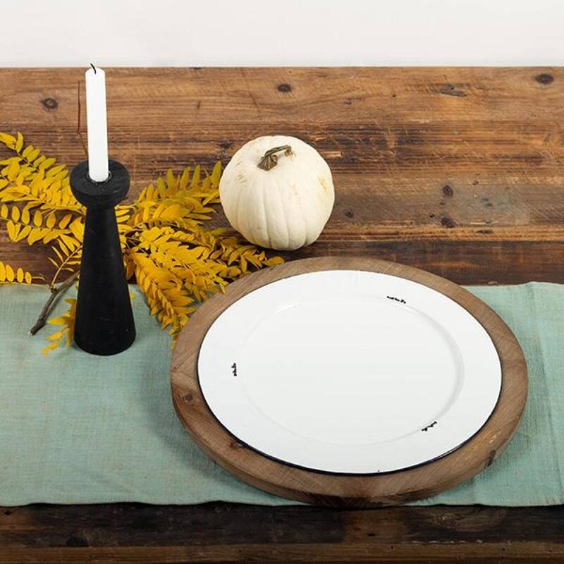 White Metal Plate In A Round Brown Built In Tray