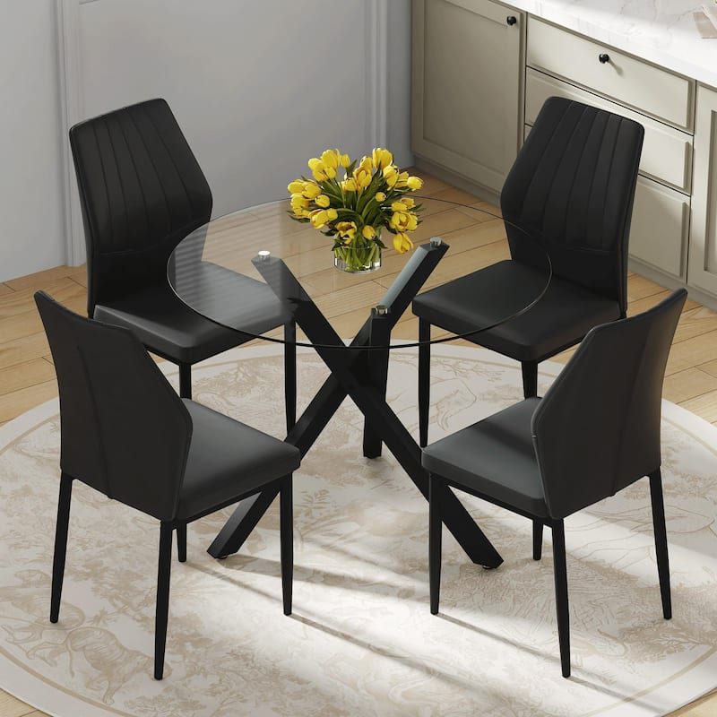 Table and chair set.Modern glass round table: X-shaped black metal bracket. Paired with 4 Dining Chairs - Black,Transparent