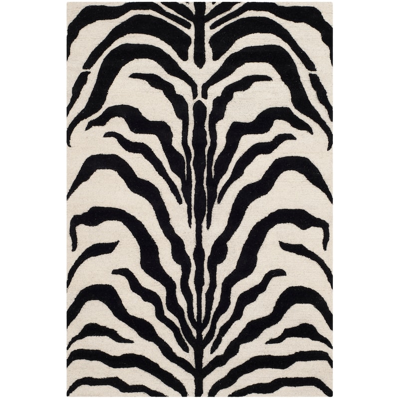 SAFAVIEH Handmade Cambridge Rikey Animal Print Wool Rug - 4' x 6' - Ivory/Black