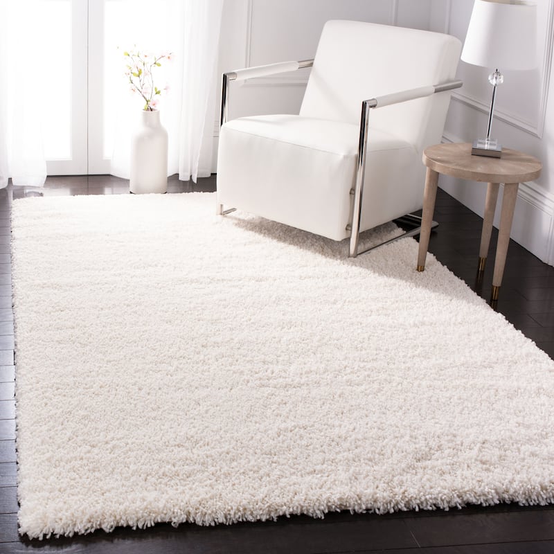 SAFAVIEH Fontana Shag Kimberlie Solid 2-inch Thick Rug - 6'7" x 9' - Ivory - Rectangle