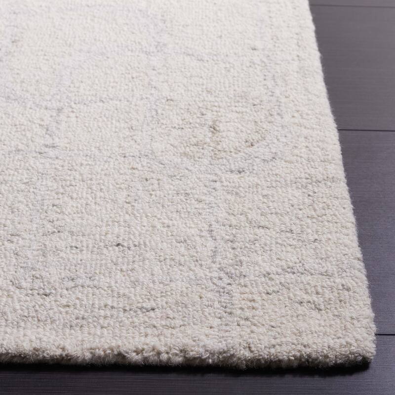 SAFAVIEH Handmade Ebony Fevzie Modern Wool Rug