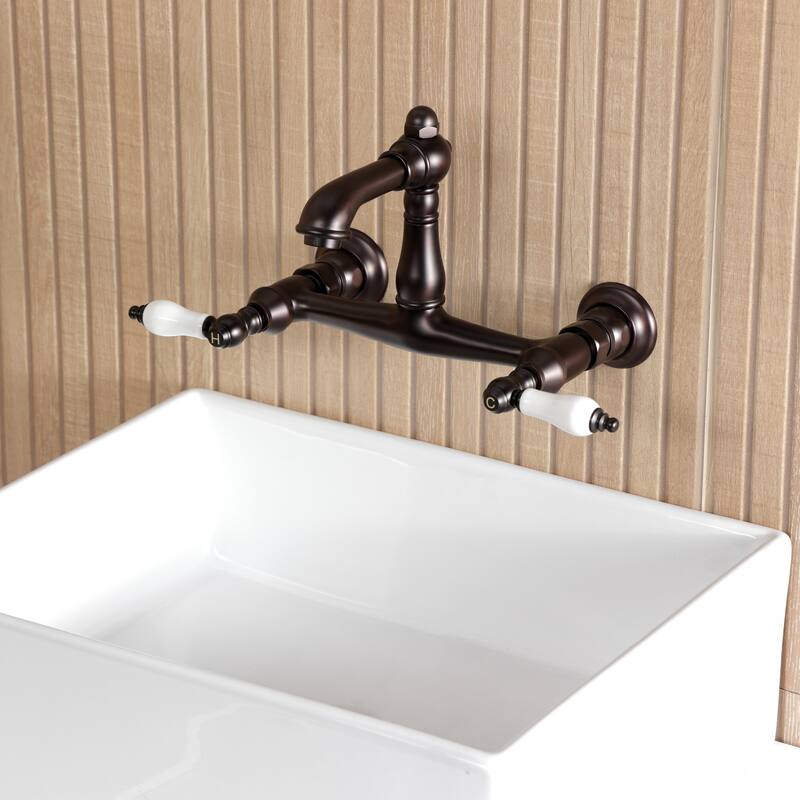 Kingston Brass English Country Two-Handle 2-Hole Wall Mount Bathroom Faucet