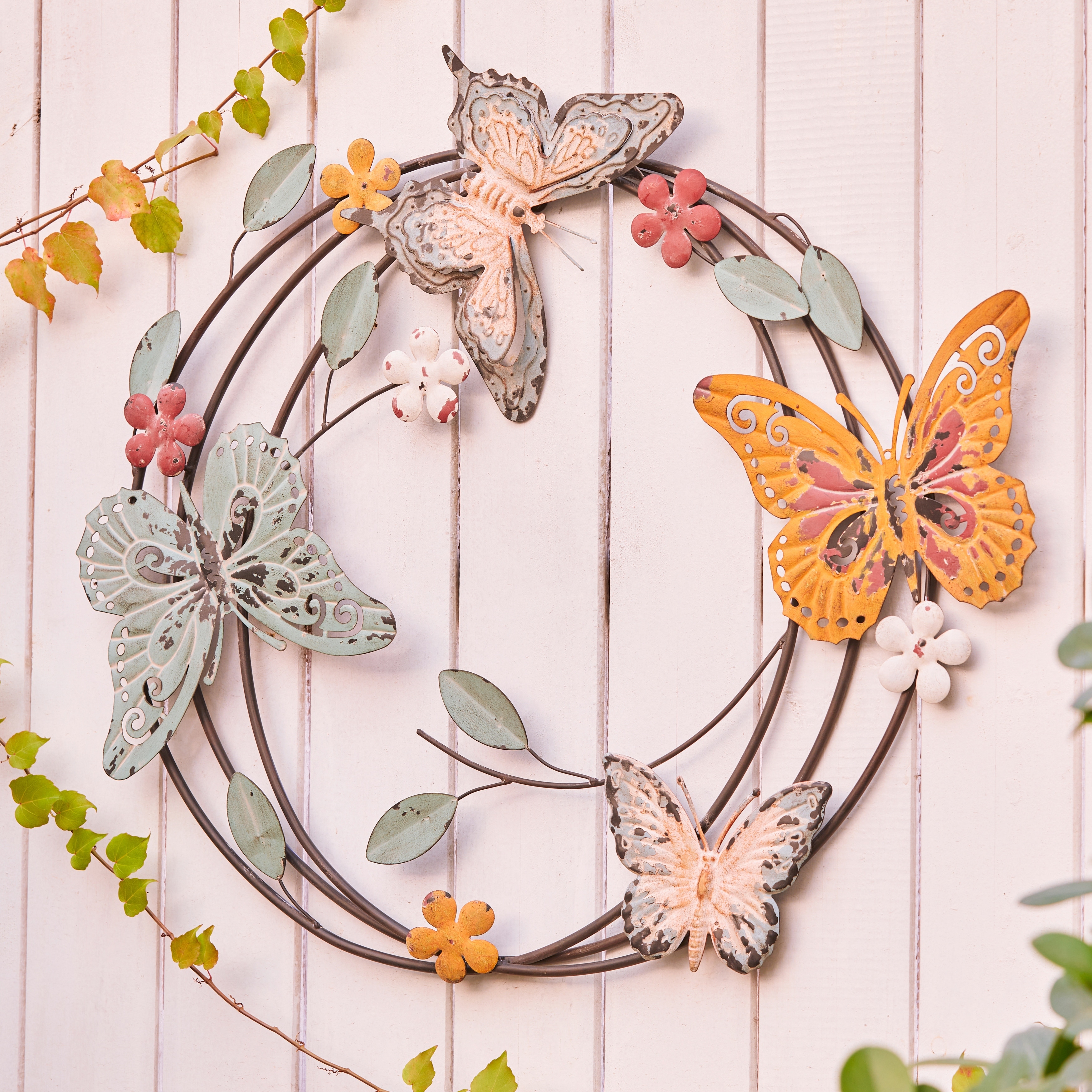 https://ak1.ostkcdn.com/images/products/is/images/direct/d51f248767cc782c18852148af01001b775ab21d/Metal-Butterflies-Round-Indoor-Outdoor-Wall-Decor.jpg