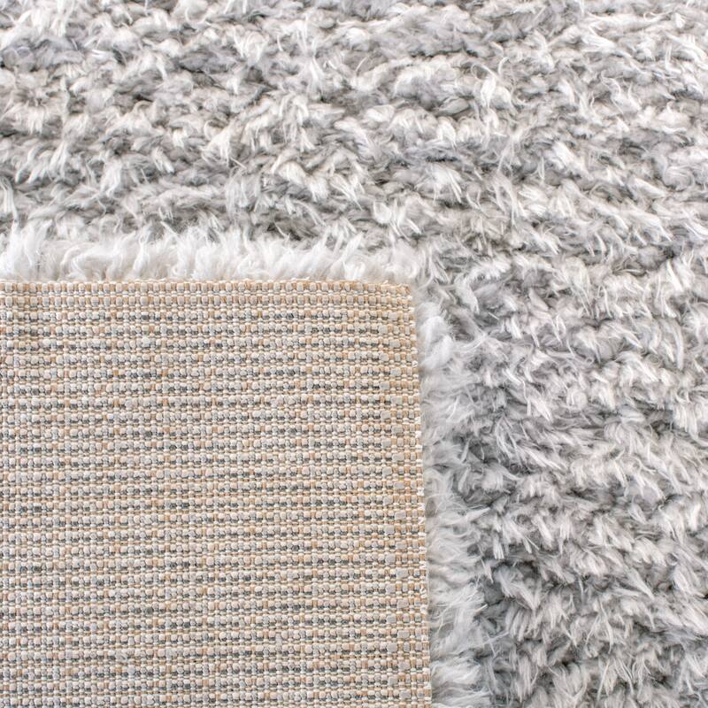 SAFAVIEH Flokati Vojsava Shag Solid Rug