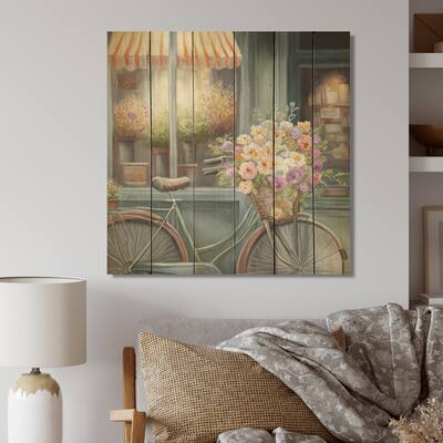 Designart 'Bicycle In Front A Flower Shop In Paris'French Landscape Wood Wall Art - Natural Pine Wood