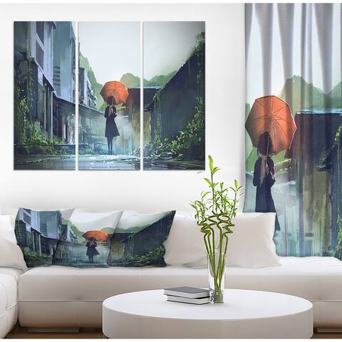 Designart "Woman with Orange umbrella" Cityscapes People Photographic on Wrapped Canvas set - 36x28 - 3 Panels