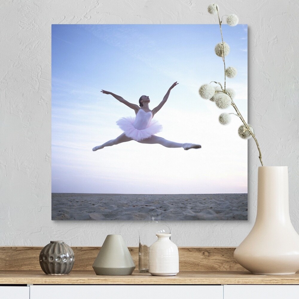 Shop Teenage Ballerina Performing Leap On Beach Low Angle View