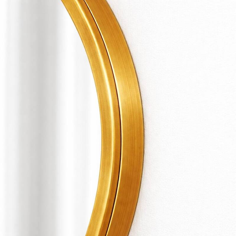 A modern-style, irregularly shaped wall-mounted mirror with a gold frame, suitable for a dressing table or bathroom