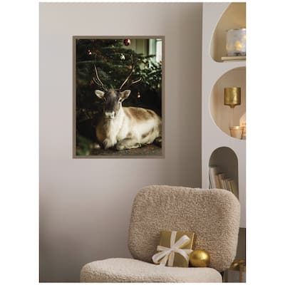Kate and Laurel Sylvie Framed Canvas Reindeer Sitting Under a Christmas Tree by Michael Schauer