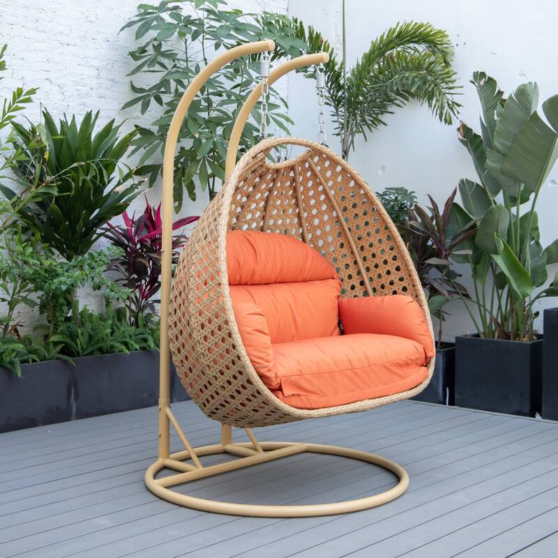 LeisureMod Mendoza 2-Person Hanging Egg Swing Chair - Handcrafted Light Brown Wicker, Patio Hammock Lounger with Cushions - 53"