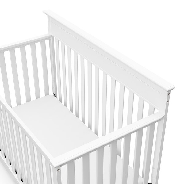 white crib and changing table set