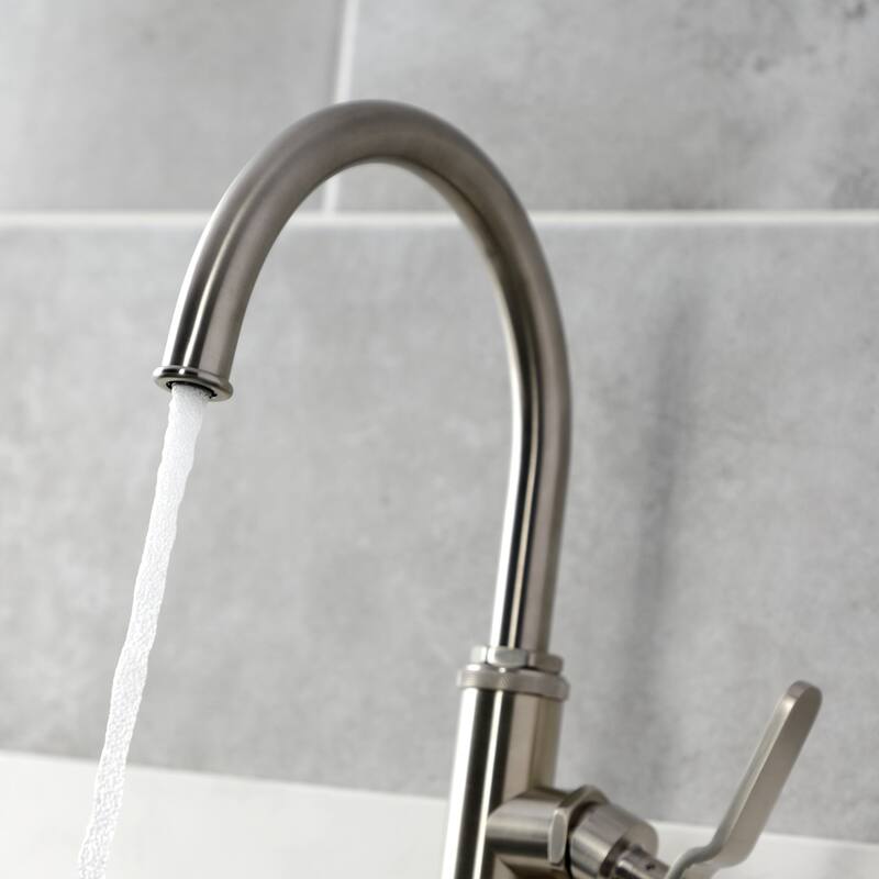 Kingston Brass Whitaker Single-Handle Deck Mount Kitchen Faucet with Brass Sprayer